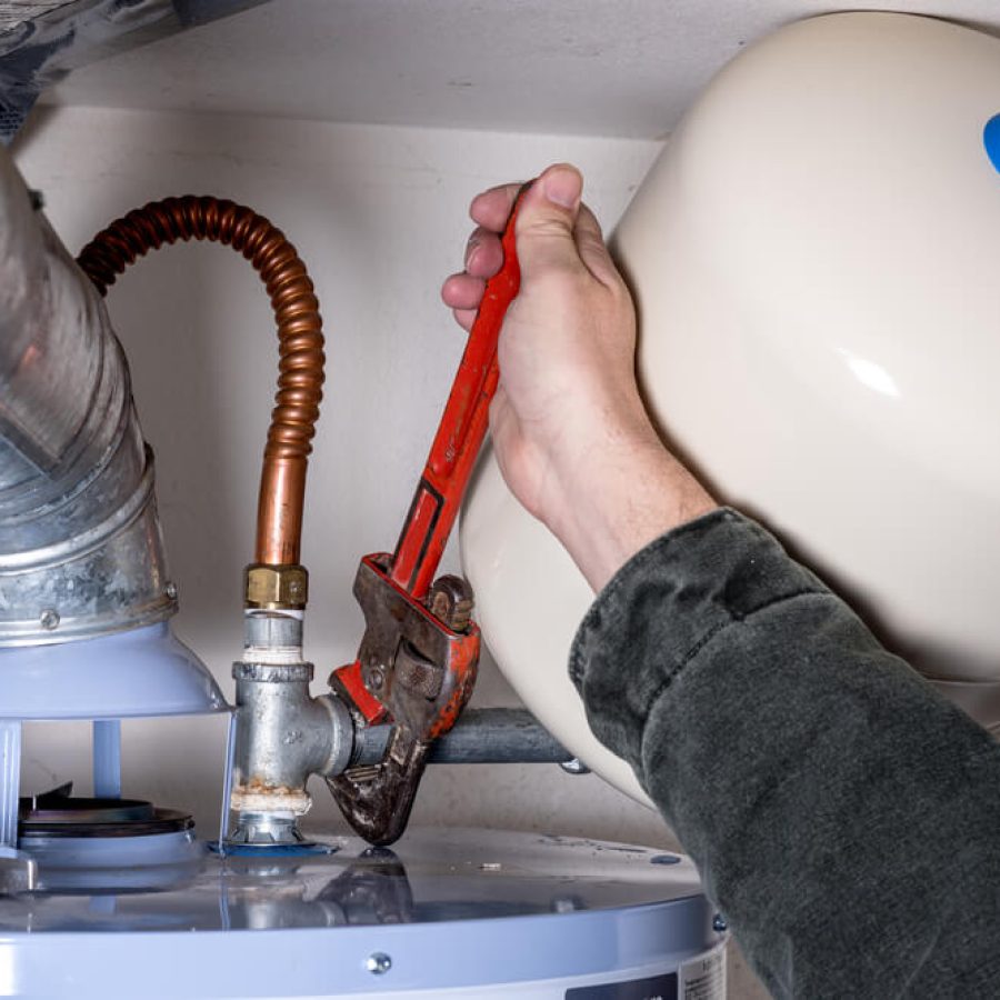 Tightening-a-pipe-on-a-water-heater